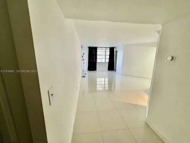 a view of empty room with windows