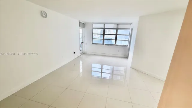 a view of staircase and white cabinets
