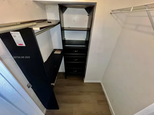 a view of an empty room and glass door