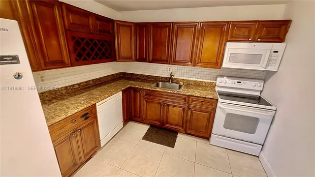 a view of a building with cars parked