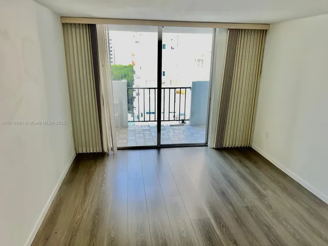 a view of balcony with furniture and garden