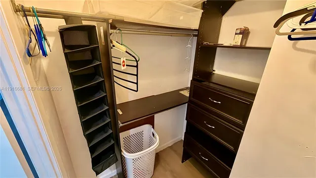 a bathroom with a sink mirror and toilet