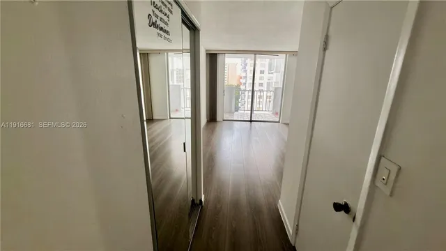 a view of a balcony with wooden floor