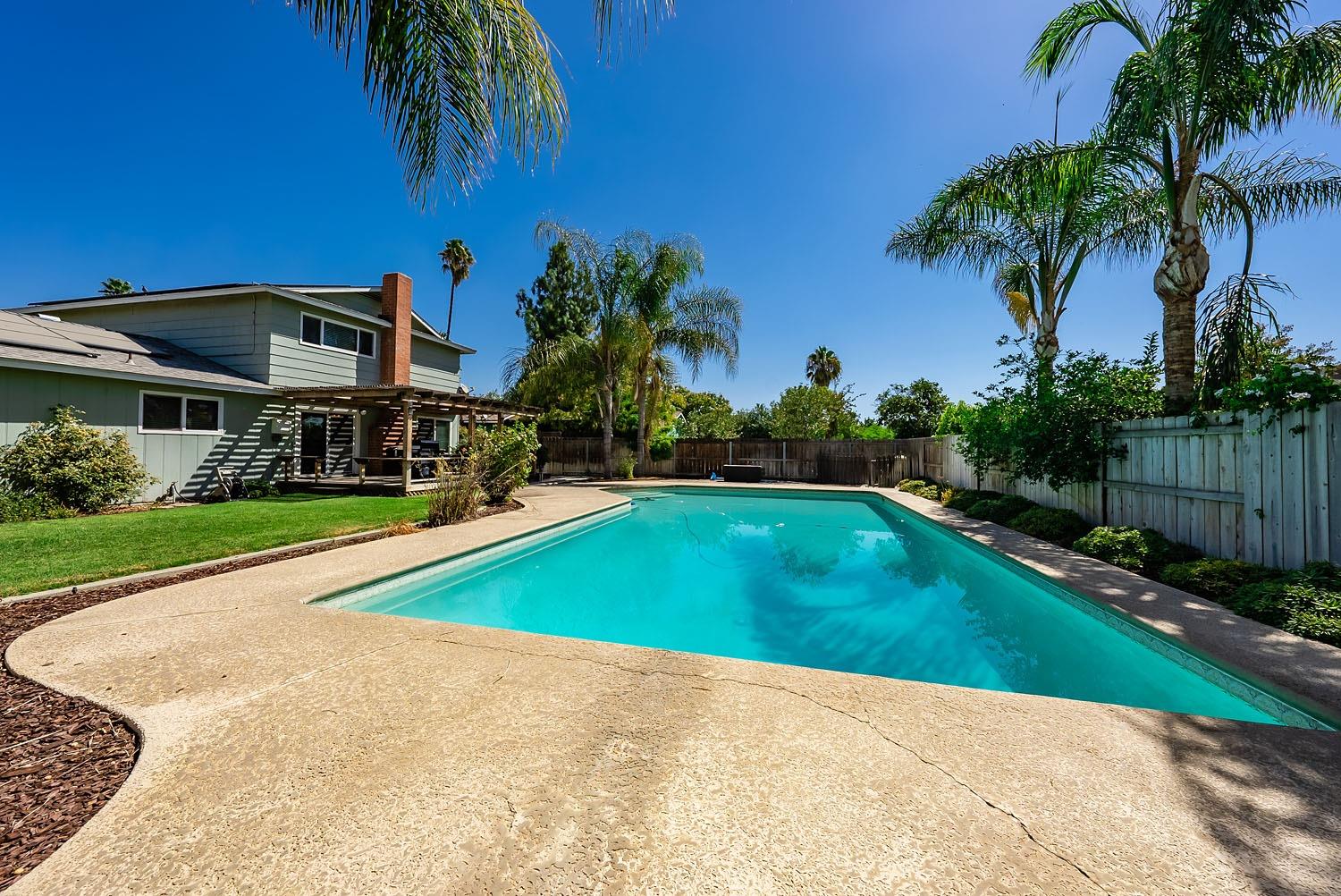 653 Meadow Lane Lemoore, CA 93245 - Photo 26 of 43 a view of outdoor space yard and swimming pool