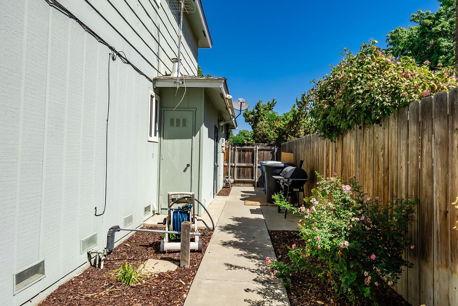 653 Meadow Lane Lemoore, CA 93245 - Photo 32 of 43 a view of a backyard with sitting area
