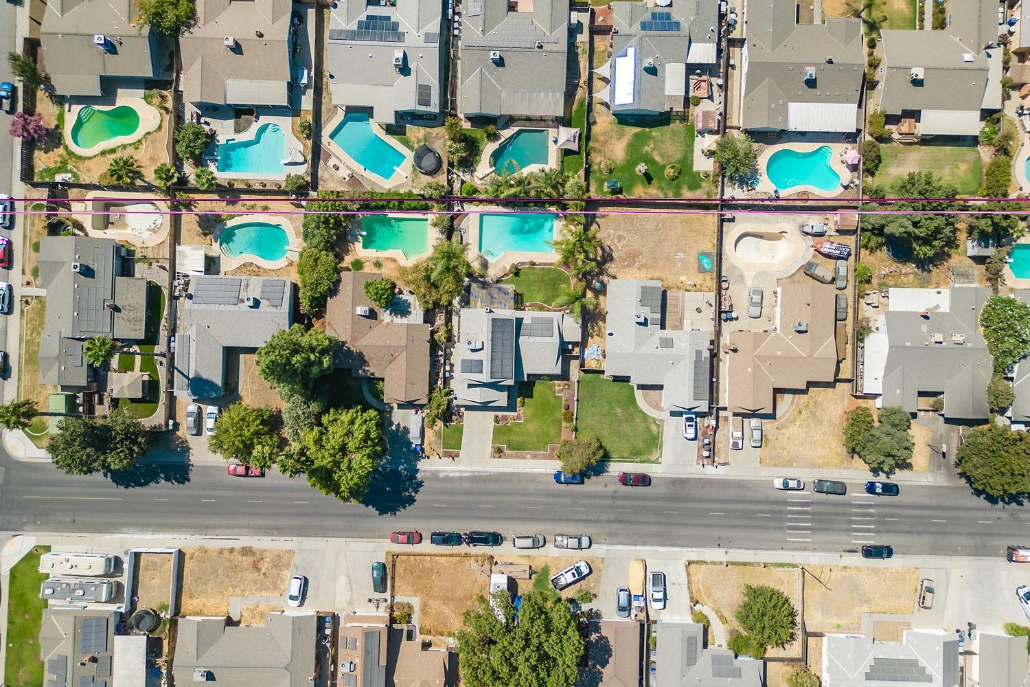 653 Meadow Lane Lemoore, CA 93245 - Photo 38 of 43 an aerial view of residential houses with outdoor space