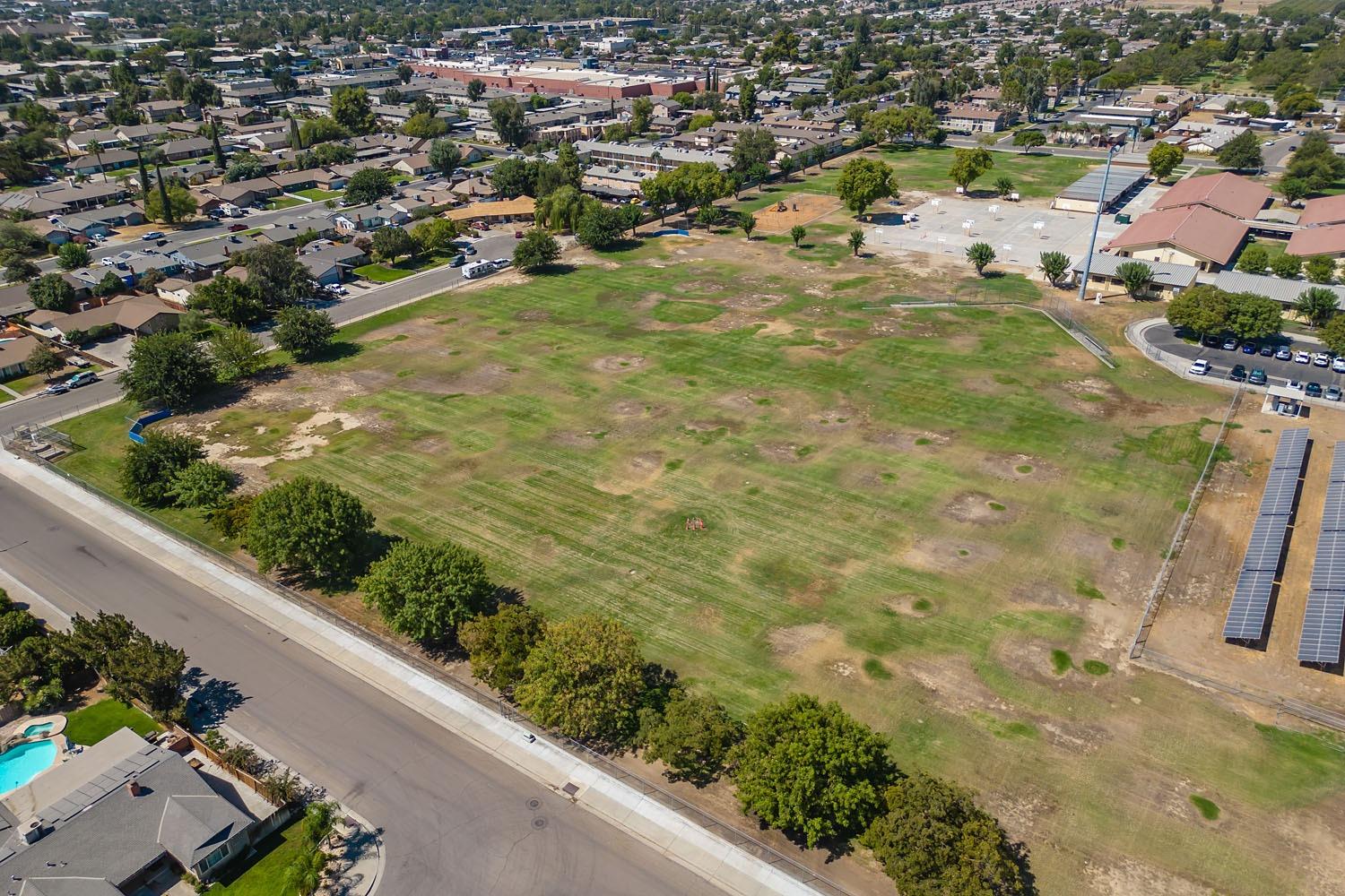 653 Meadow Lane Lemoore, CA 93245 - Photo 40 of 43 an aerial view of residential houses with outdoor space