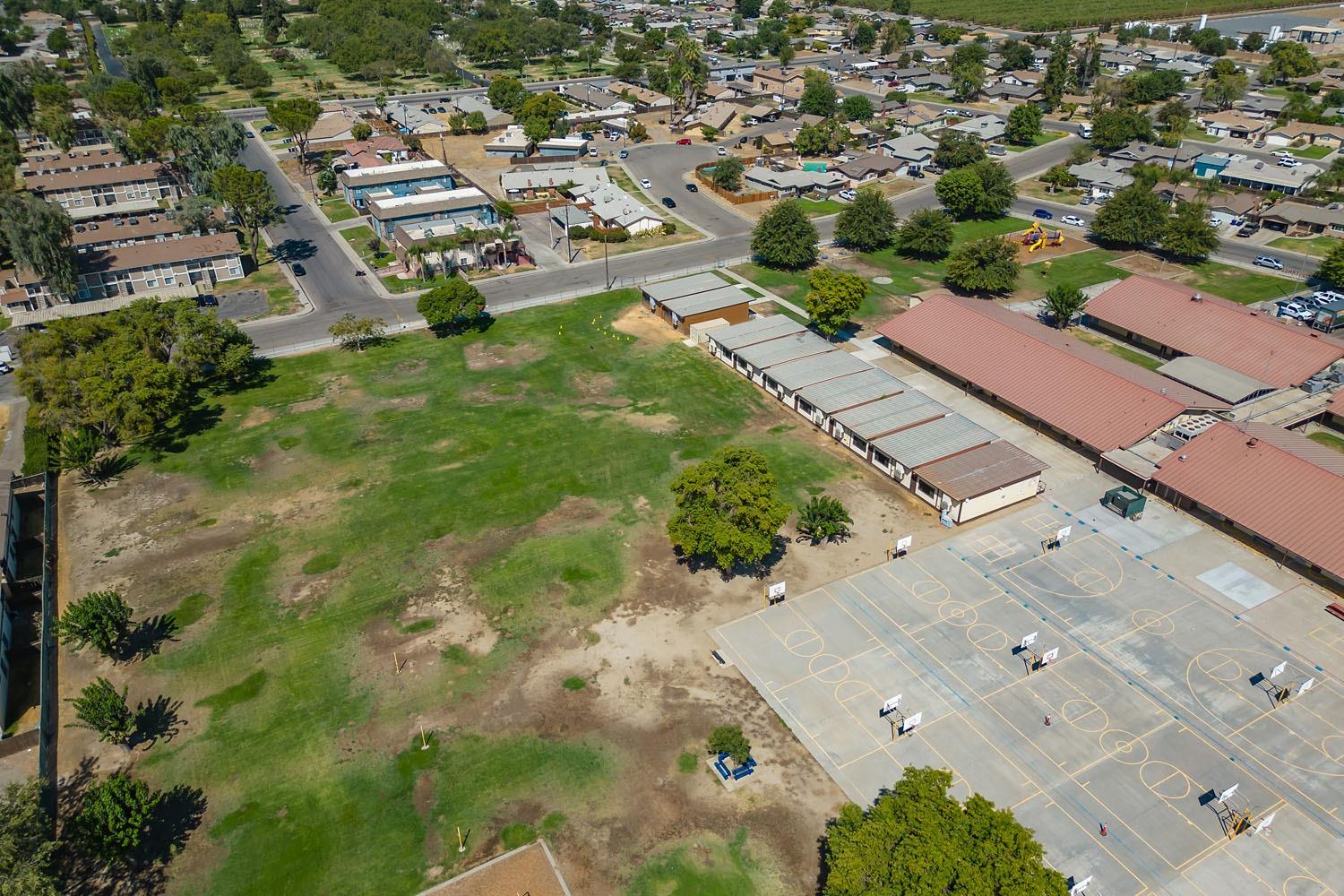 653 Meadow Lane Lemoore, CA 93245 - Photo 41 of 43 an aerial view of residential houses with outdoor space