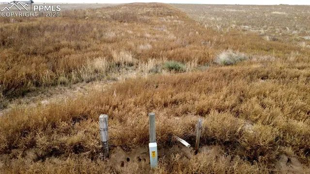 an aerial view of house with yard and mountain view