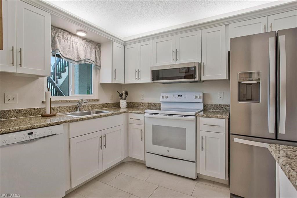 4258 27th Court Southwest, Unit 106 Naples, FL 34116 - Photo 7 of 19 Room for all your kitchen needs