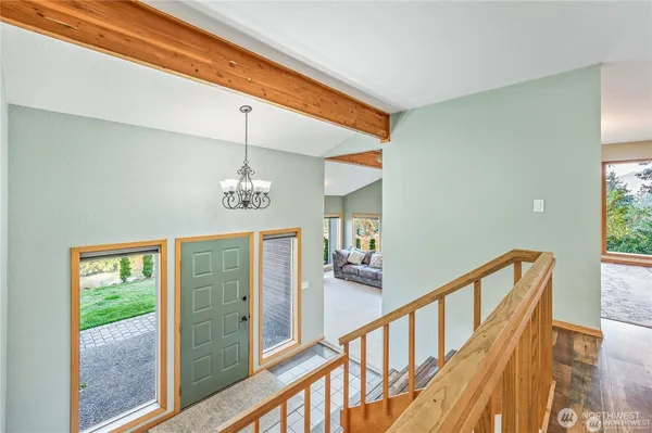 a view of a hallway with windows