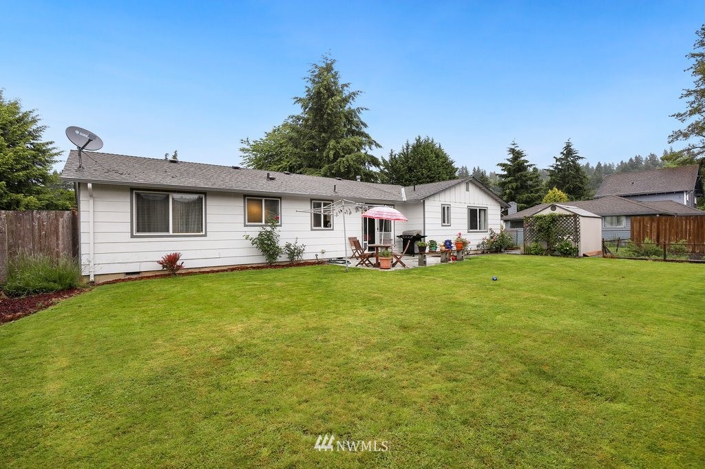 16 R Place Northeast Auburn, WA 98002 - Photo 11 of 12 a front view of house with yard and green space