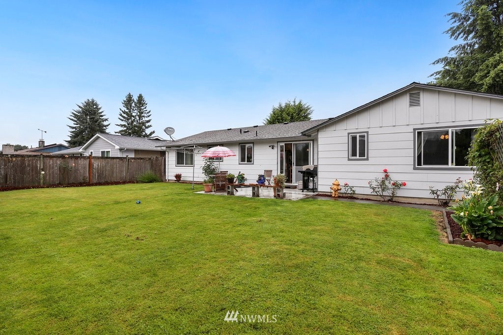 16 R Place Northeast Auburn, WA 98002 - Photo 12 of 12 a front view of house with yard outdoor seating and green space