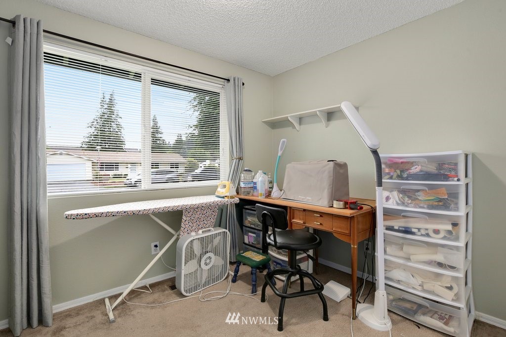 16 R Place Northeast Auburn, WA 98002 - Photo 7 of 12 a view of a workspace with furniture and a window