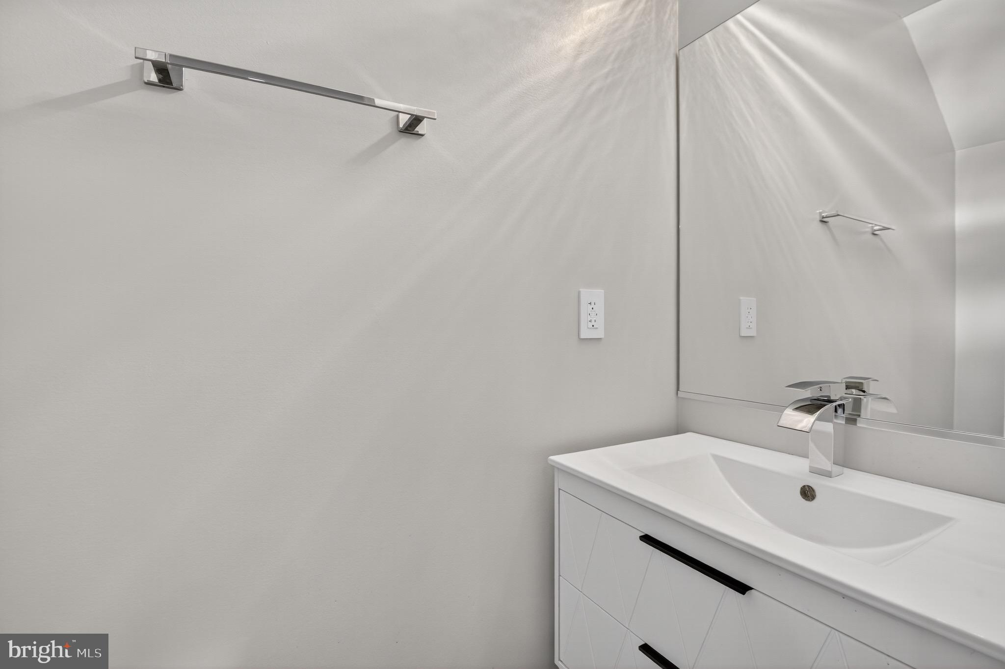 3712 13th Street Northwest Washington, DC 20010 - Photo 15 of 35 Sleek modern powder room with elegant fixtures.