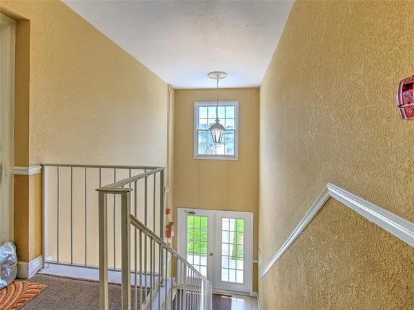a view of a hallway with windows