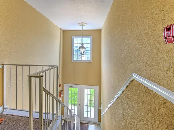 a view of an entryway with wooden floor