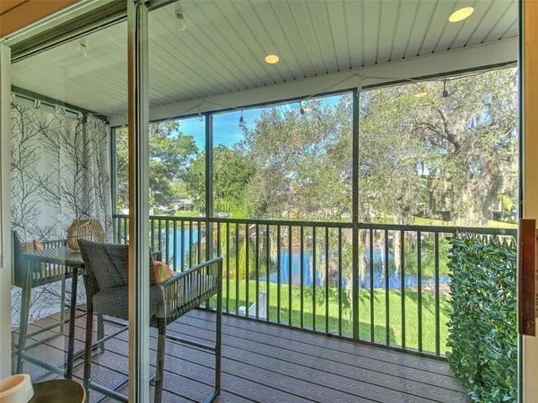 a view of a balcony with furniture