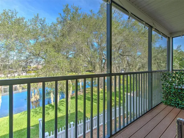 a bedroom with furniture and a book shelf