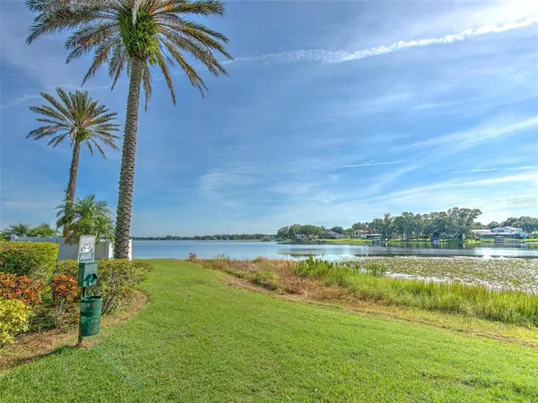 a view of a lake with a yard