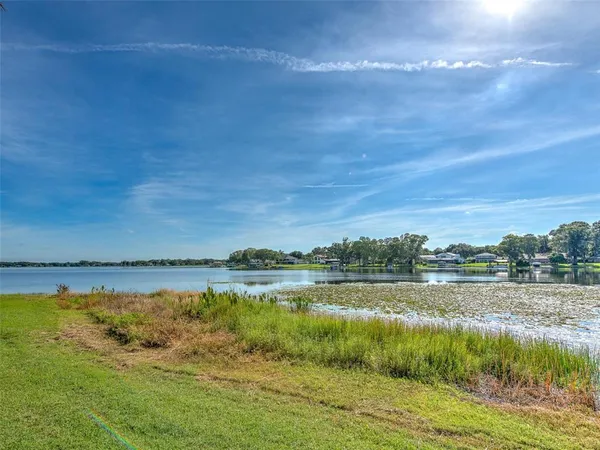 a view of a fountain in front of a house