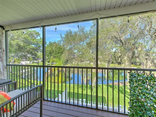 a view of a porch with a floor to ceiling window