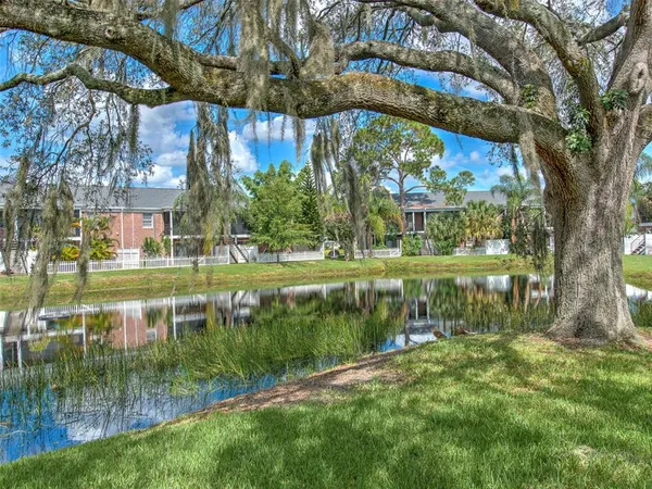 a view of a lake with a building in the background