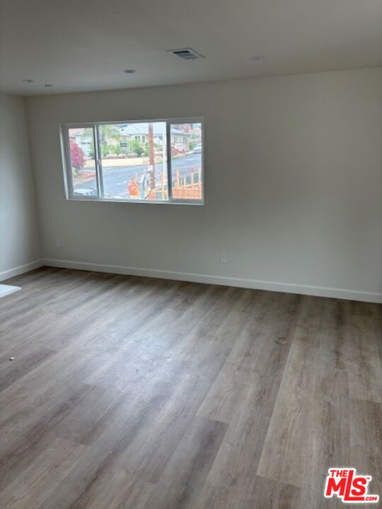 7072 Summitrose Street Tujunga, CA 91042 - Photo 4 of 10 an empty room with a window