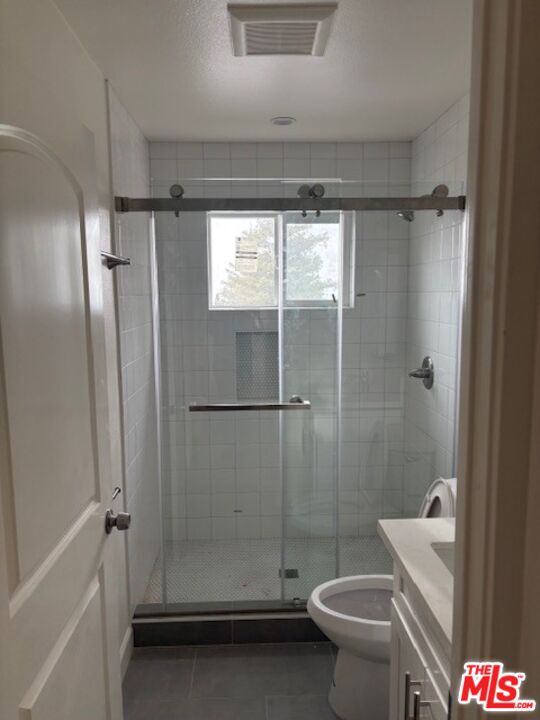 7072 Summitrose Street Tujunga, CA 91042 - Photo 9 of 10 a bathroom with a shower and a toilet