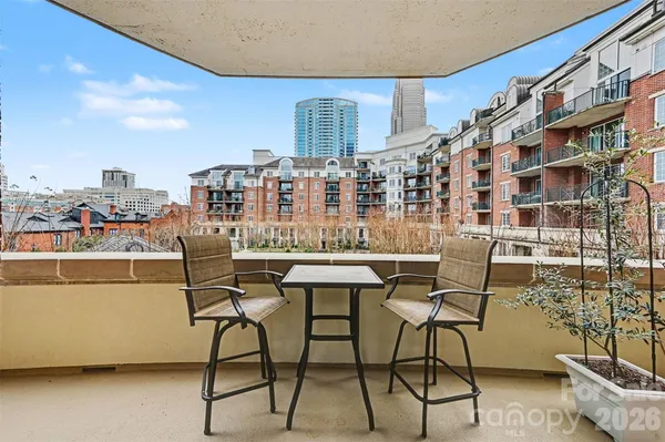 a view of a chairs and table in a patio