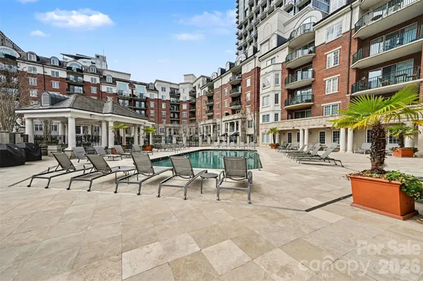 a view of a patio with couches and table and chairs