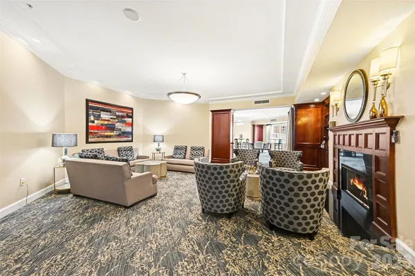 a very nice looking room with a large window and couch