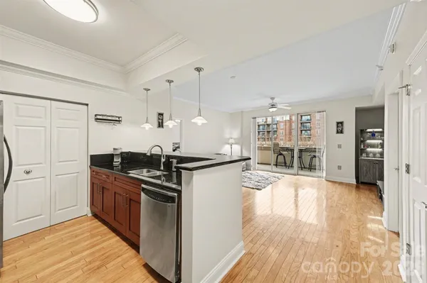 a kitchen with stainless steel appliances granite countertop a stove and a refrigerator