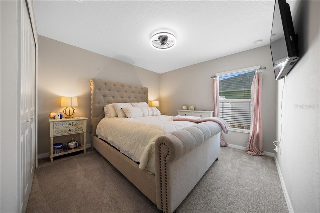 9329 Southwest 57th Terrace Ocala, FL 34476 - Photo 32 of 64 a bed room with a bed and a television