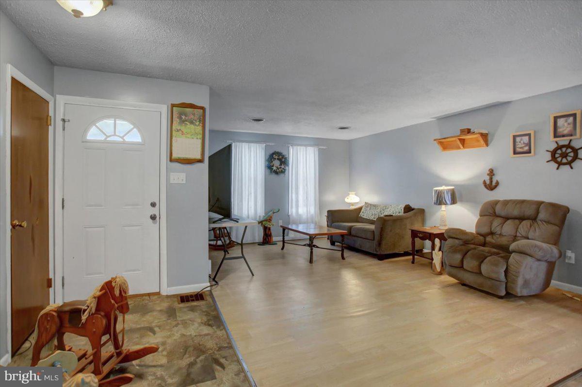 8582 Rice Road Shippensburg, PA 17257 - Photo 13 of 41 a living room with furniture and a couch
