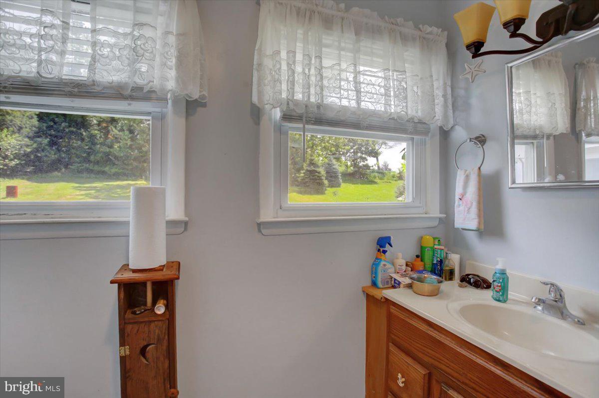 8582 Rice Road Shippensburg, PA 17257 - Photo 14 of 41 a bathroom with a sink and a window