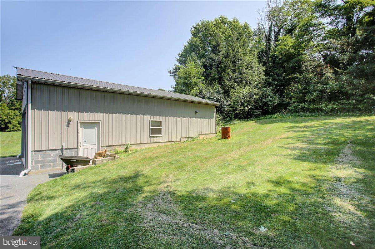 8582 Rice Road Shippensburg, PA 17257 - Photo 16 of 41 a backyard of a house with table and chairs
