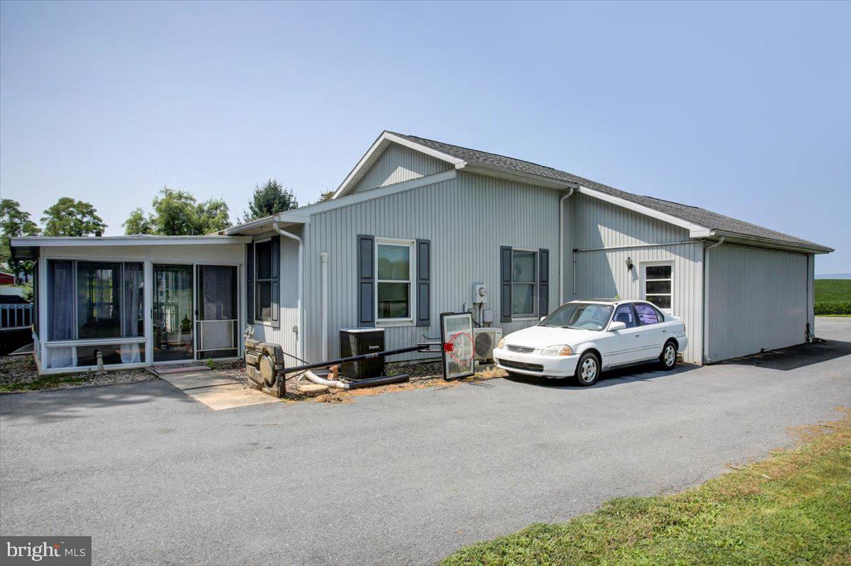 8582 Rice Road Shippensburg, PA 17257 - Photo 18 of 41 a view of a car parked in front of a house