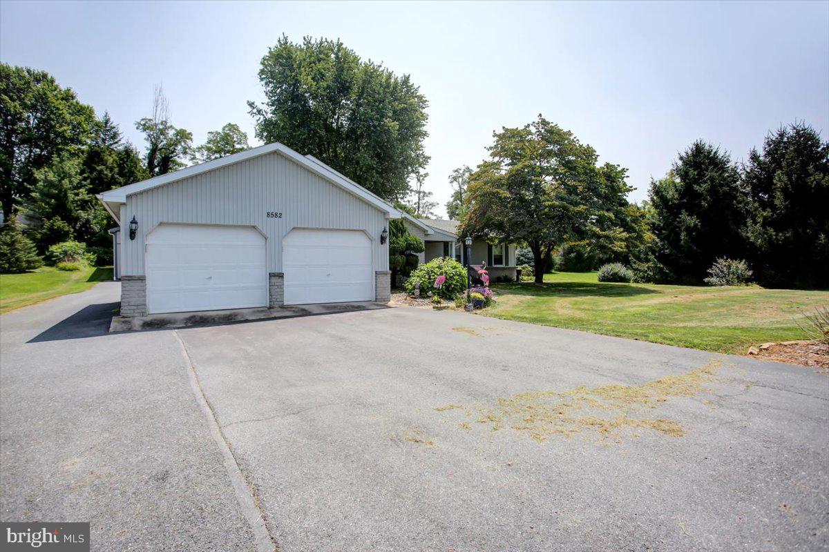 8582 Rice Road Shippensburg, PA 17257 - Photo 20 of 41 a view of a house with backyard and trees