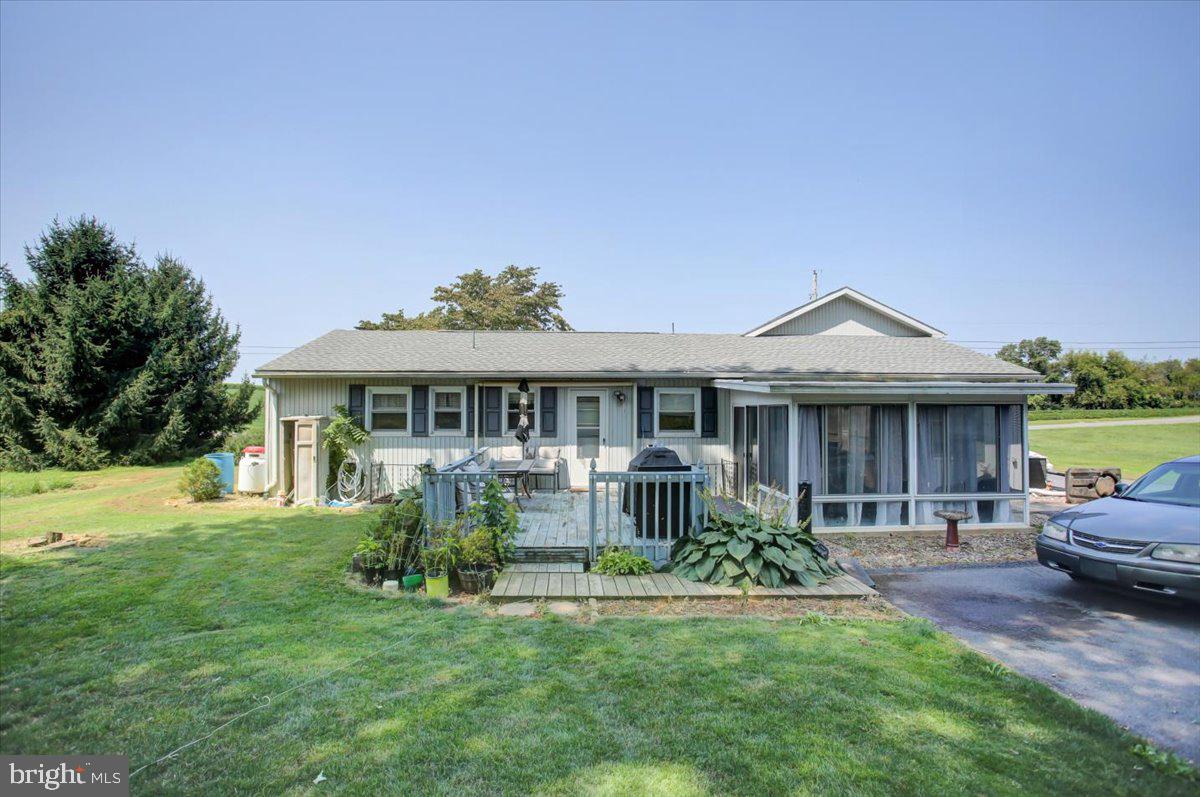 8582 Rice Road Shippensburg, PA 17257 - Photo 2 of 41 a front view of a house with a yard table and chairs