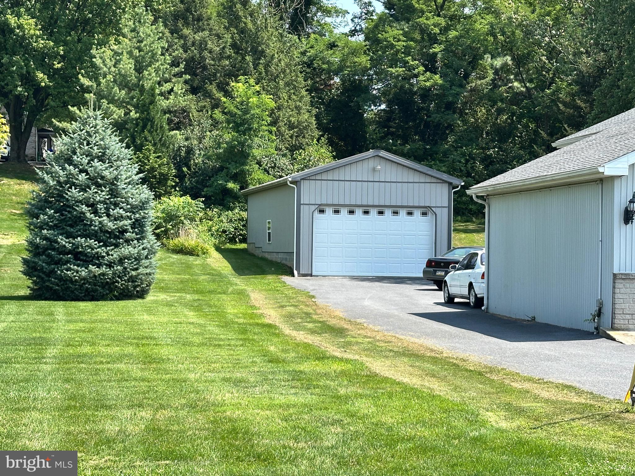 8582 Rice Road Shippensburg, PA 17257 - Photo 3 of 41 a front view of a house with a yard