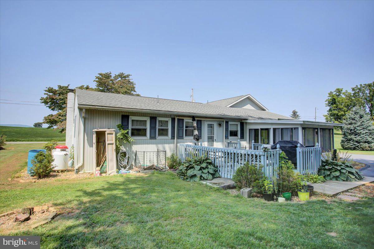 8582 Rice Road Shippensburg, PA 17257 - Photo 32 of 41 a front view of a house with a garden and yard