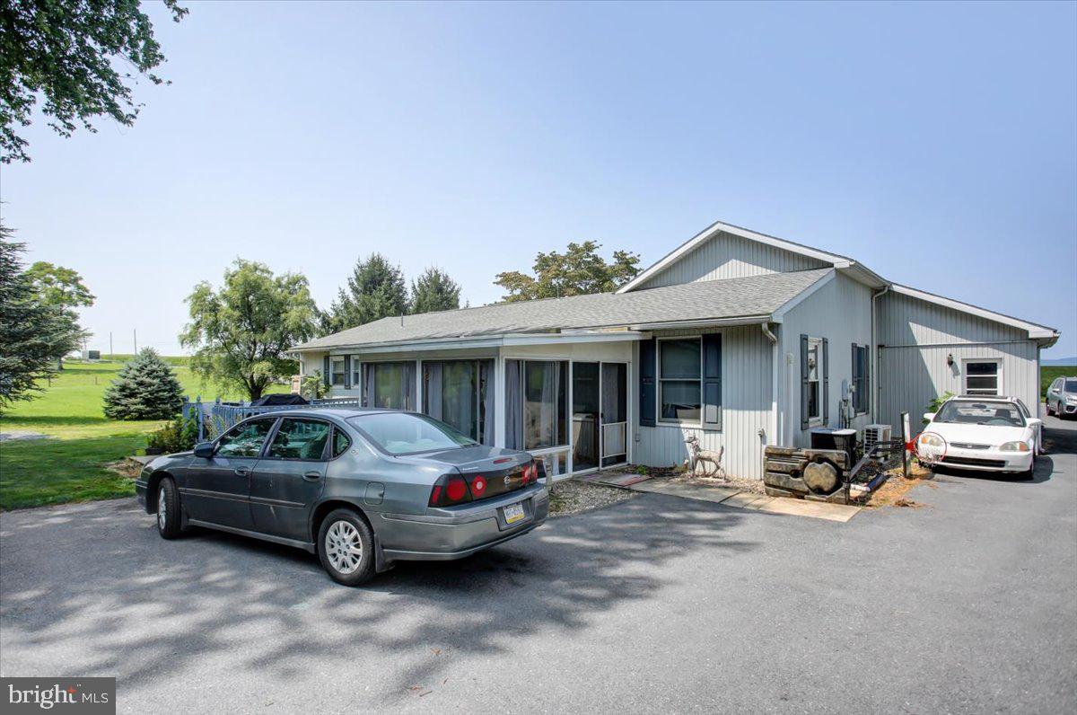 8582 Rice Road Shippensburg, PA 17257 - Photo 5 of 41 a car parked in front of a house