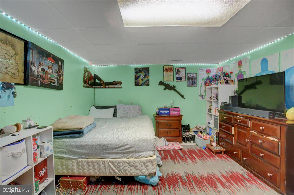 8582 Rice Road Shippensburg, PA 17257 - Photo 7 of 41 a bedroom with furniture and a flat screen tv