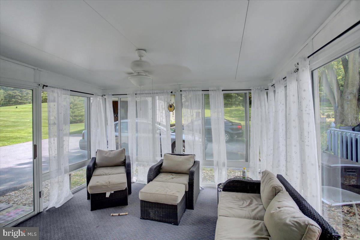 8582 Rice Road Shippensburg, PA 17257 - Photo 9 of 41 a living room with furniture and a large window