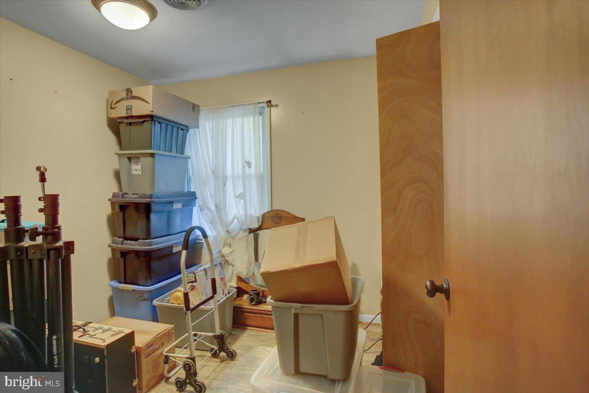 8582 Rice Road Shippensburg, PA 17257 - Photo 10 of 41 a room with furniture and a flat screen tv