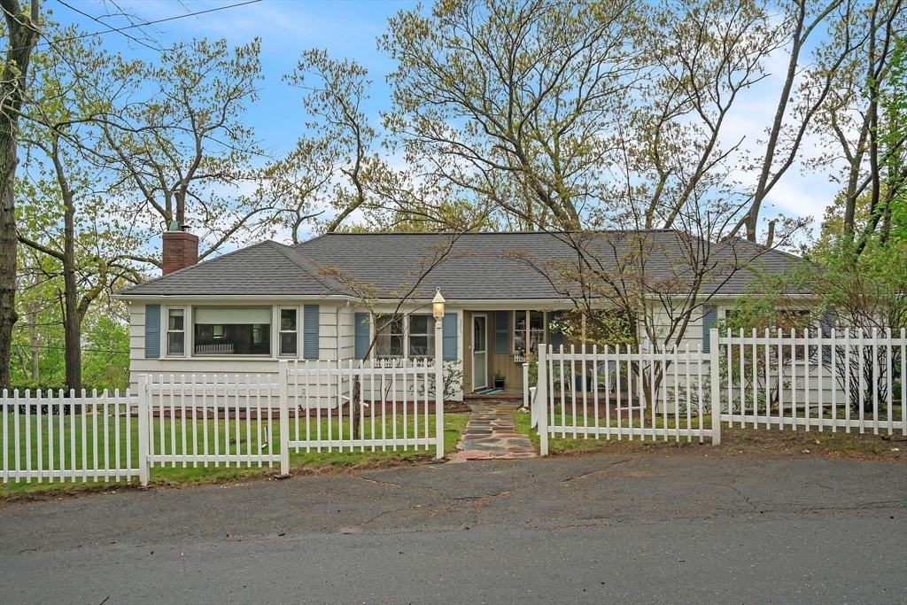 171 Virginia Road Waltham, MA 02453 - Photo 1 of 25 a front view of a house with a garden