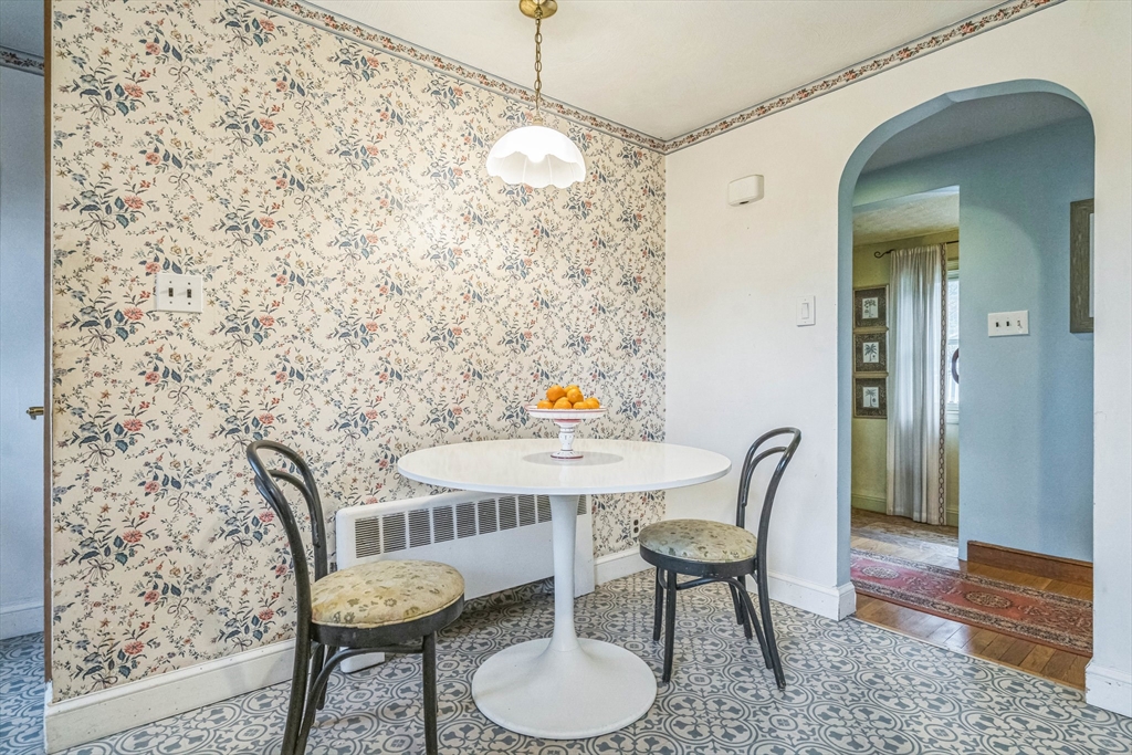171 Virginia Road Waltham, MA 02453 - Photo 15 of 25 a view of a dining room with furniture and wooden floor