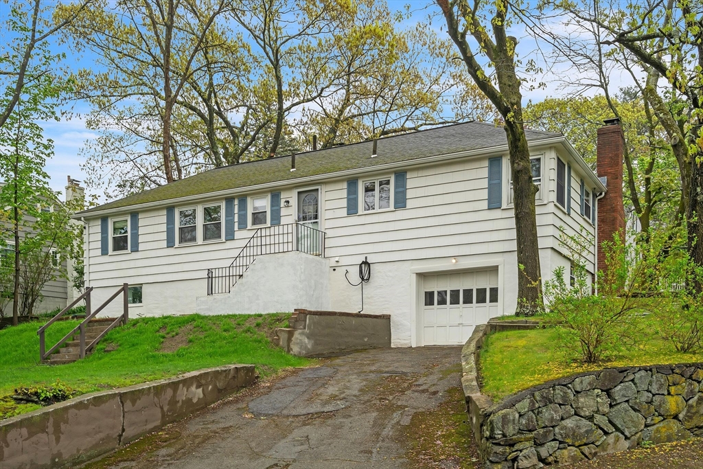 171 Virginia Road Waltham, MA 02453 - Photo 5 of 25 a view of a house with a garden