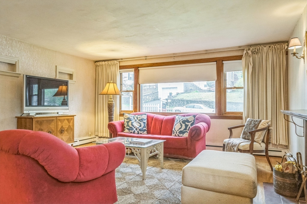 171 Virginia Road Waltham, MA 02453 - Photo 7 of 25 a living room with furniture and a large window